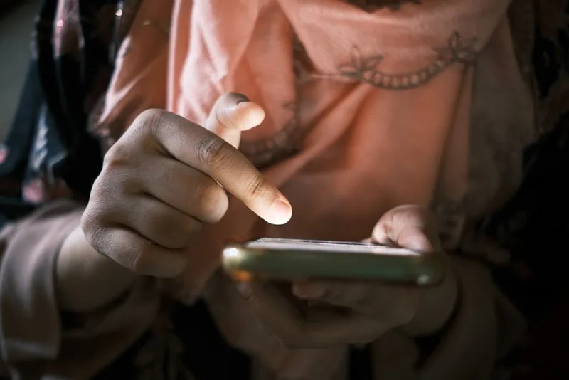 person scrolling phone screen