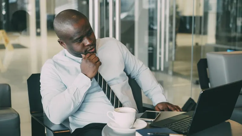 businessman thinking laptop coffee