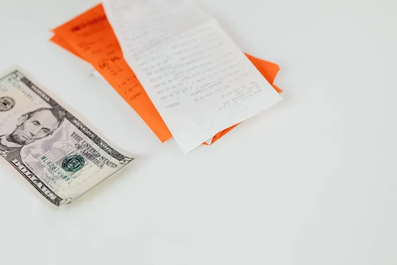 us dollar bills stack desk receipt