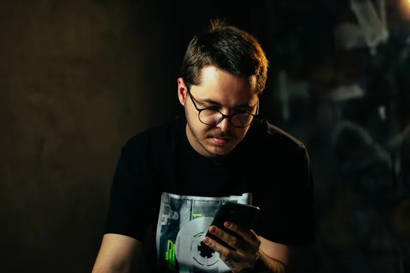 man focused mobile phone study