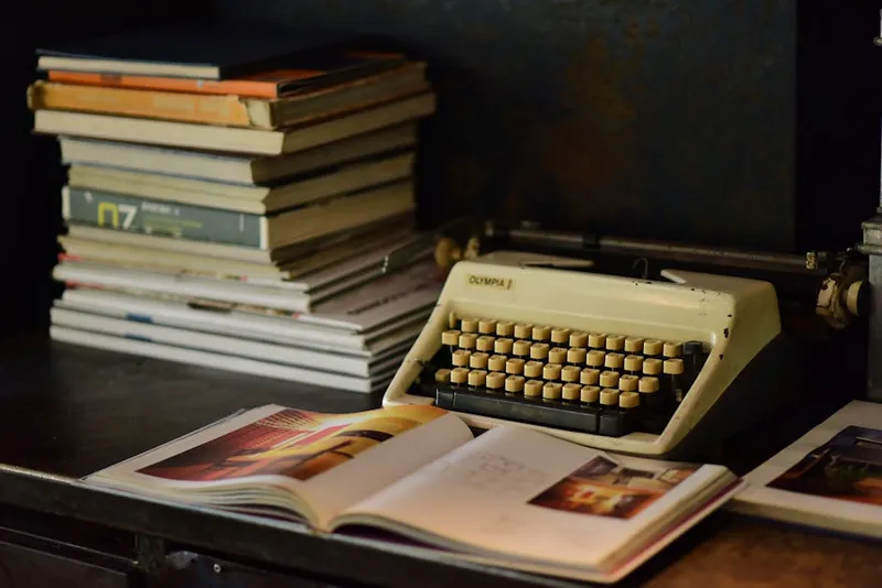 typewriter and old book