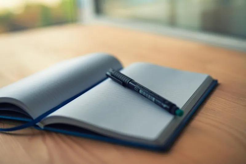 open notebook with pen study