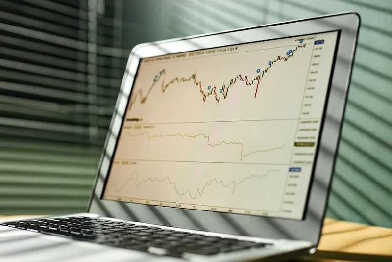 stock market graph upward trend laptop