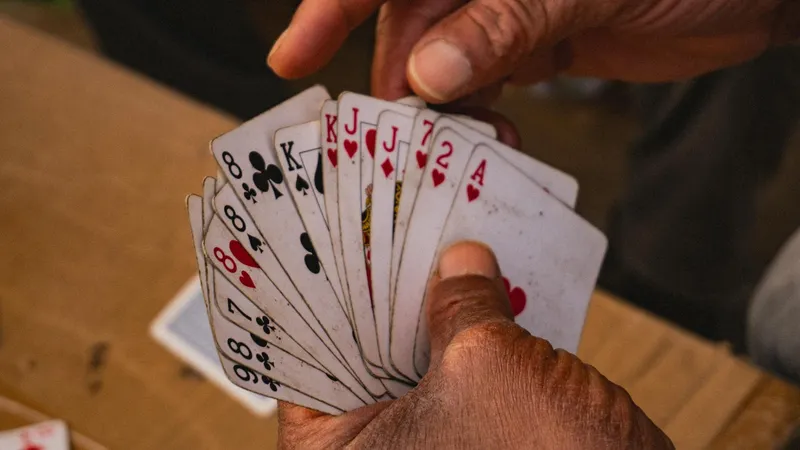red playing card fanned hand close