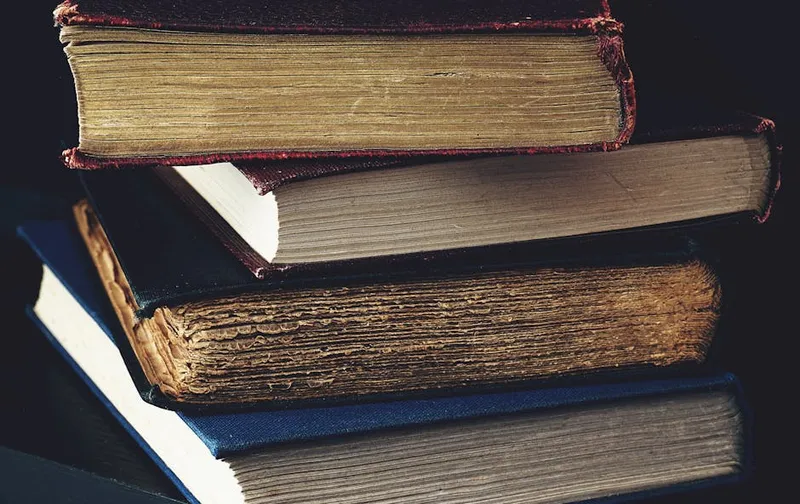 stack of old hardcover books