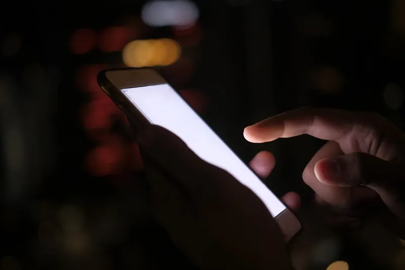 smartphone glowing in dark
