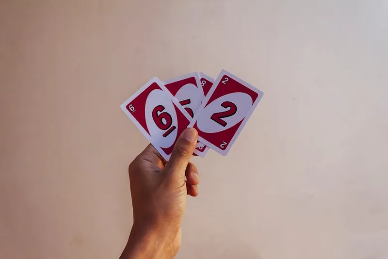 red playing card numbers row