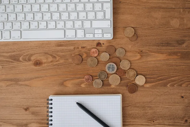 calculator coins notebook desk close