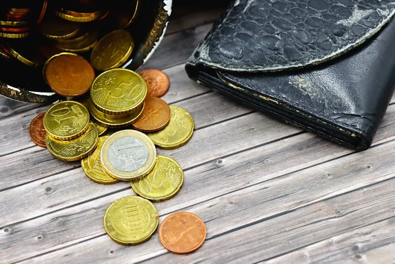 empty wallet coins on table
