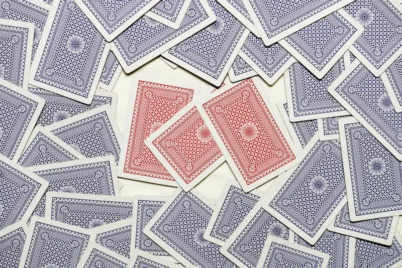 single playing card spread red back fan