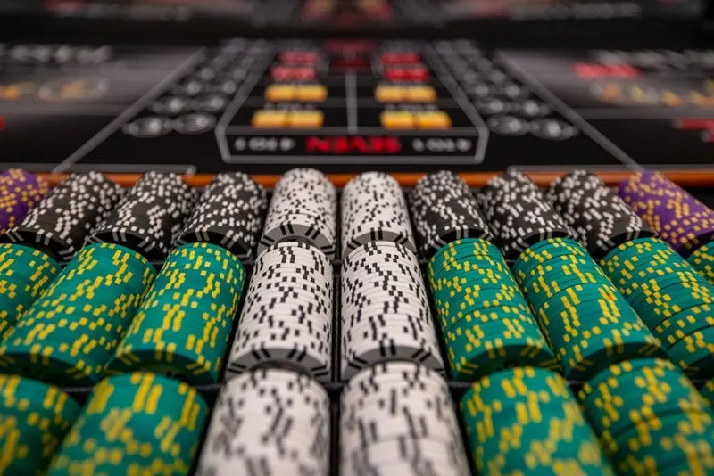 casino chips green stack tall low light