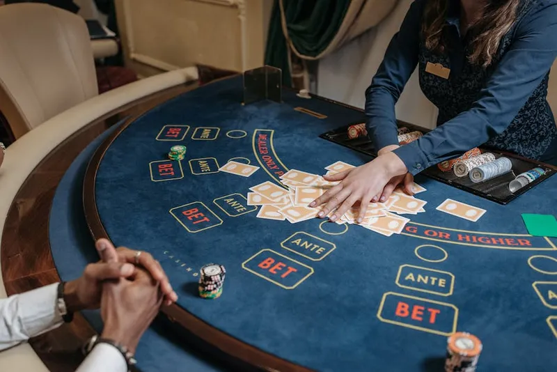 casino dealer male hands shuffle close macro