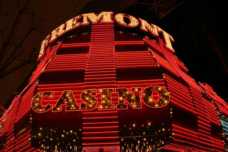 neon vegas casino sign night street rain