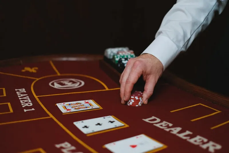 casino dealer croupier hands chips finger